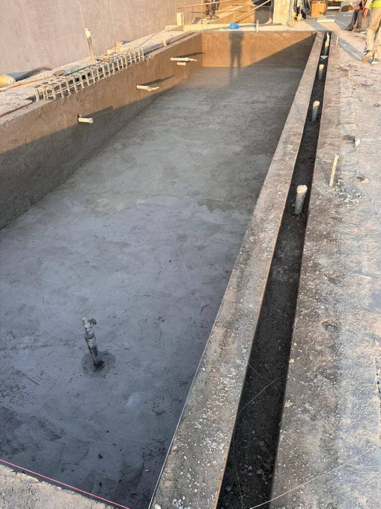 Outdoor living area construction underway in Dubai — Poolsco Landscaping