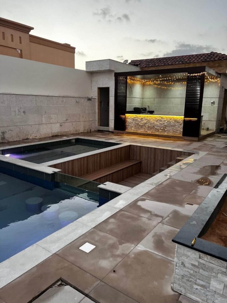 Natural stone retaining wall construction for Dubai villa — Poolsco Landscaping